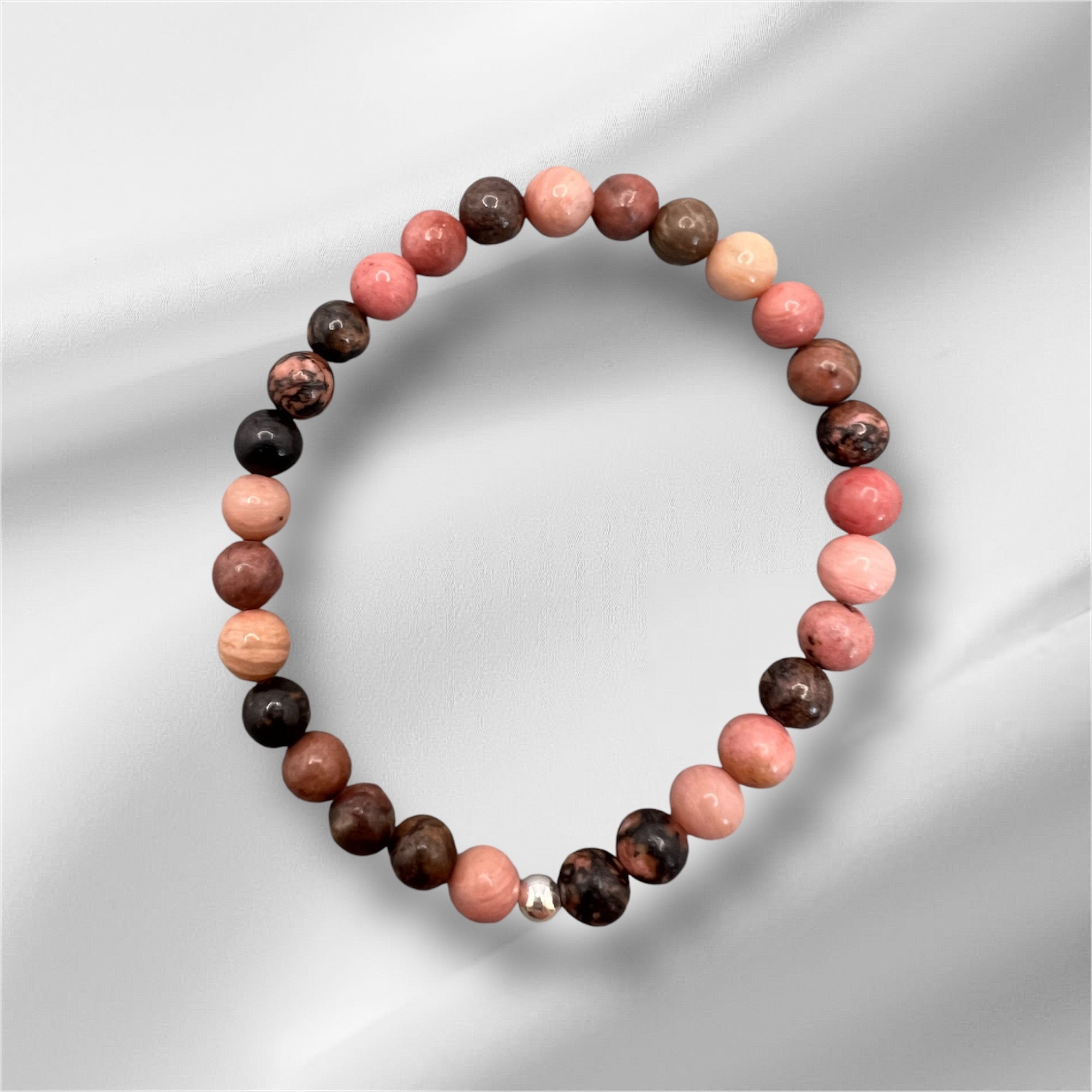 Rhodonit Armband mit bunten Edelsteinperlen, handgefertigt für Vergebung und emotionale Heilung, elastisches Design, hochwertige Verarbeitung, wasserfest, wählbar in zwei Größen.