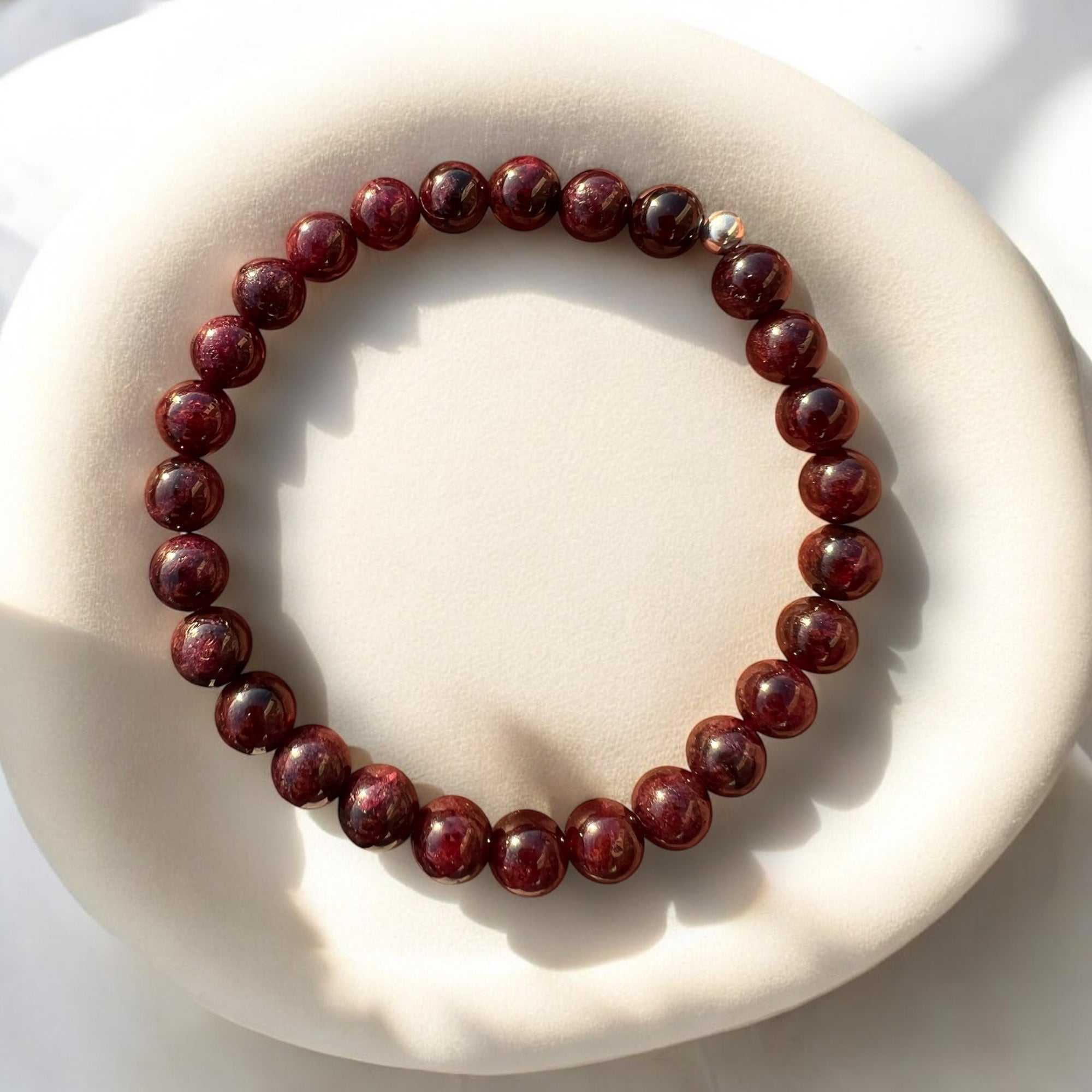Handcrafted garnet bracelet with deep red beads for strength and passion.